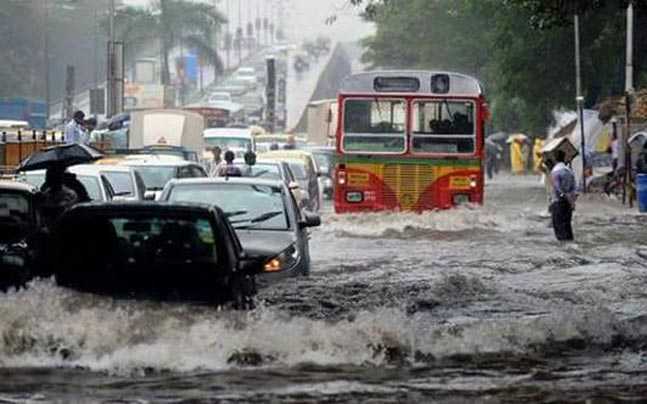 Live: Mumbai rains make the entire city a brown river. According to weather officials, this is the worst bout of rain since July 26, 2005. On that day the city of Mumbai was flooded and cars were stranded on the roads with people in it. Many areas of the city are under a lockdown now because of waist high water and vehicles not able to move.